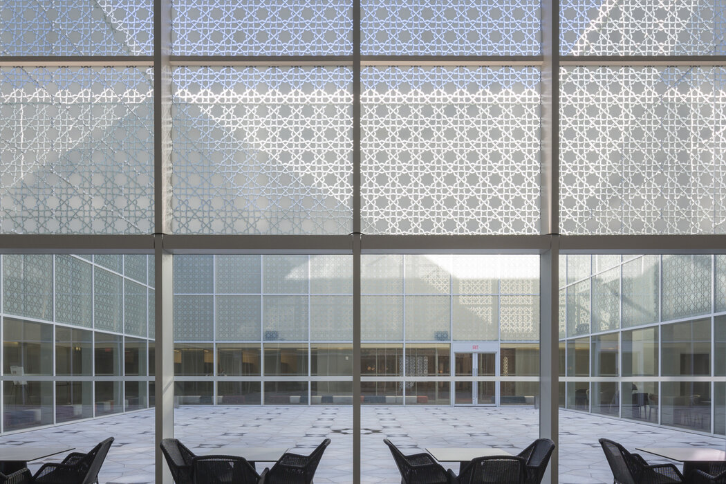 Aga Khan Museum entrance looking into courtyard through geometric screen